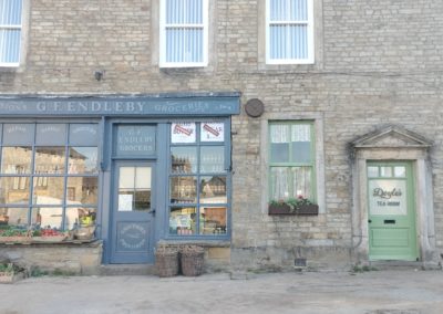 G F Endelby Greengrocers, (the Stripey Badger Bookshop) and the new Doyle's Cafe (The Stripey Badger Coffee Shop & Kitchen)